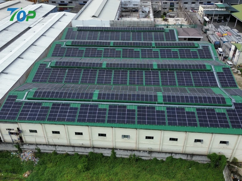Commercial solar racking system installed on an industrial factory metal roof in Manila.